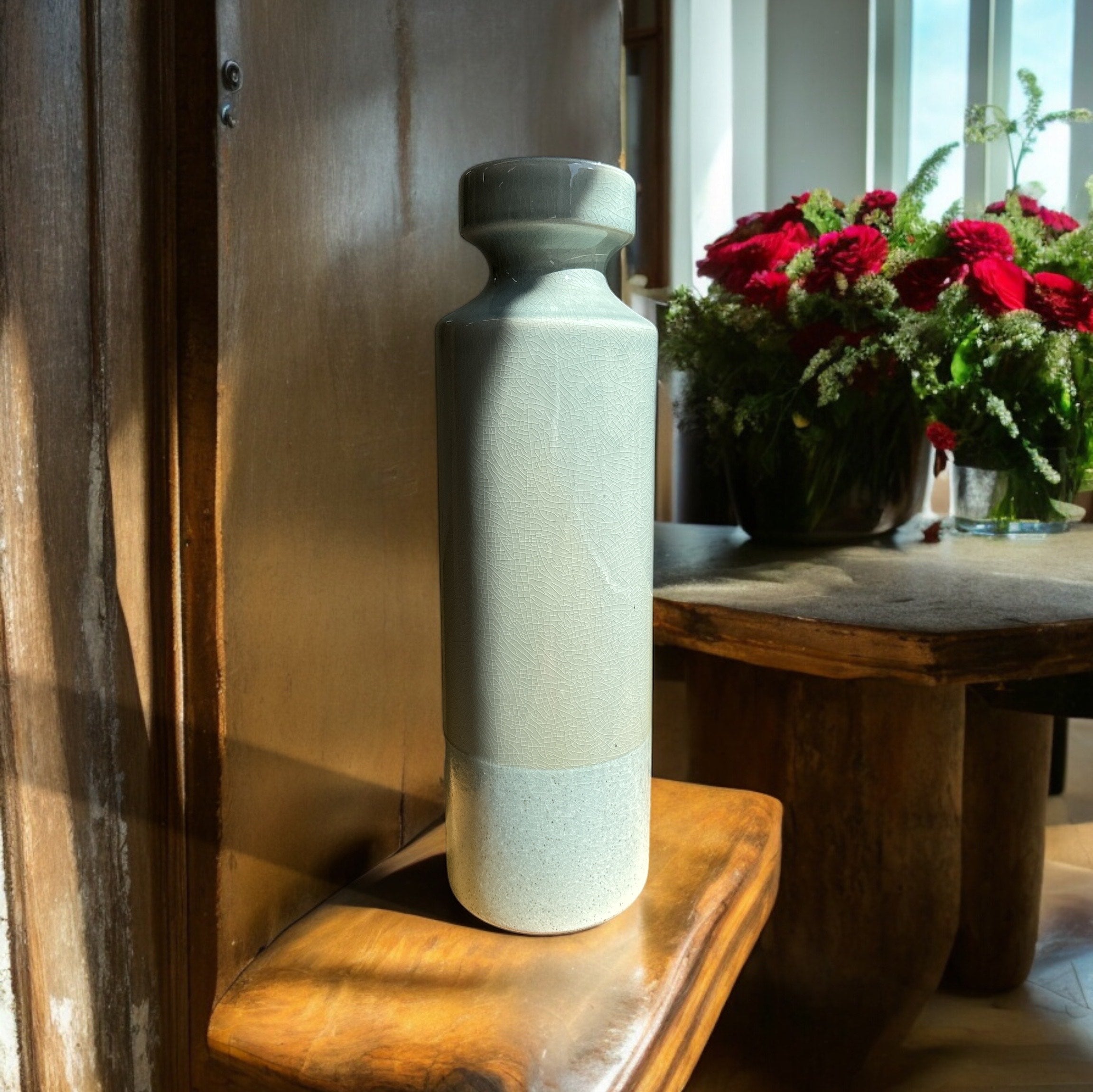 Standing at an impressive 47cm tall this vase is sure to make an impact.Extra Tall Decorative Marine Green Ceramic Vase