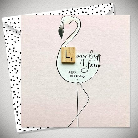A lovely pastel pink greetings card to wish a loved one or friend a happy birthday. Complete with a pretty flamingo print, with a scrabble decorative piece.